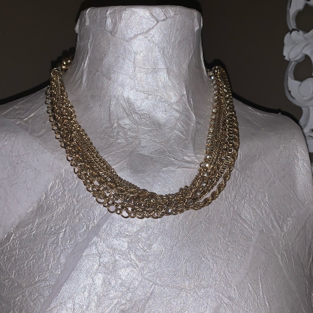 Multi strand gold and rhinestone necklace.